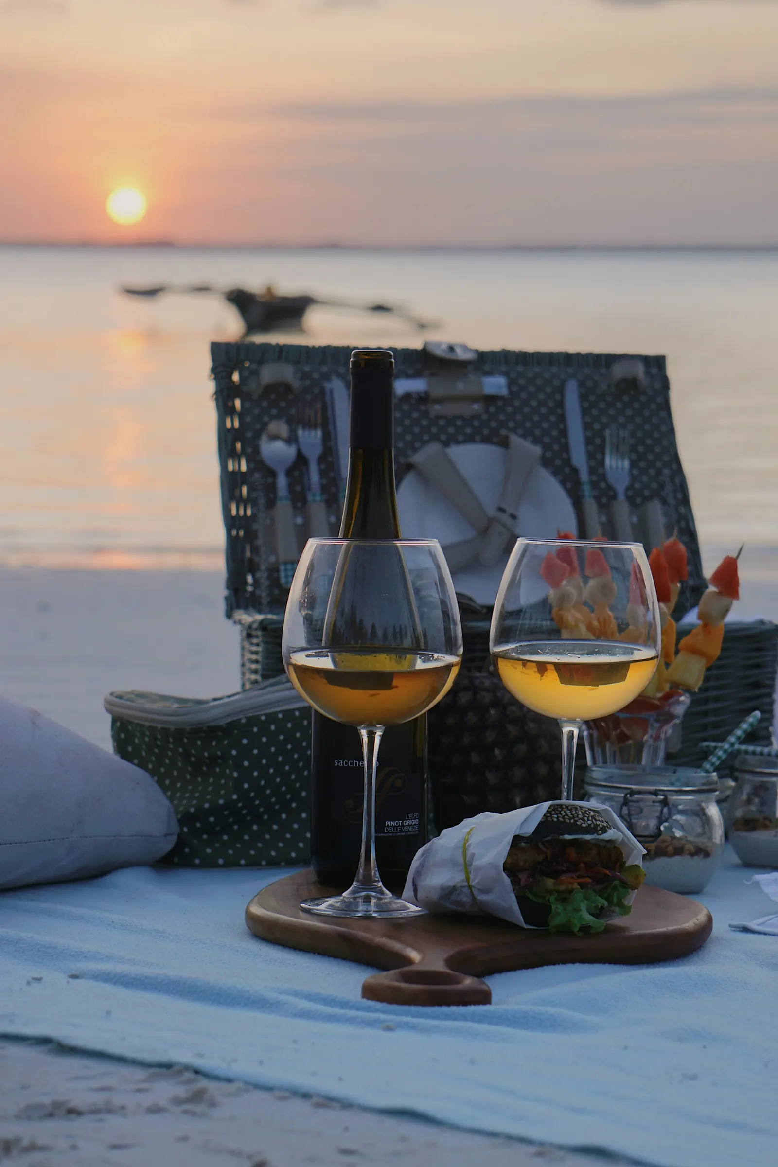 picnic on the beach with wine glasses