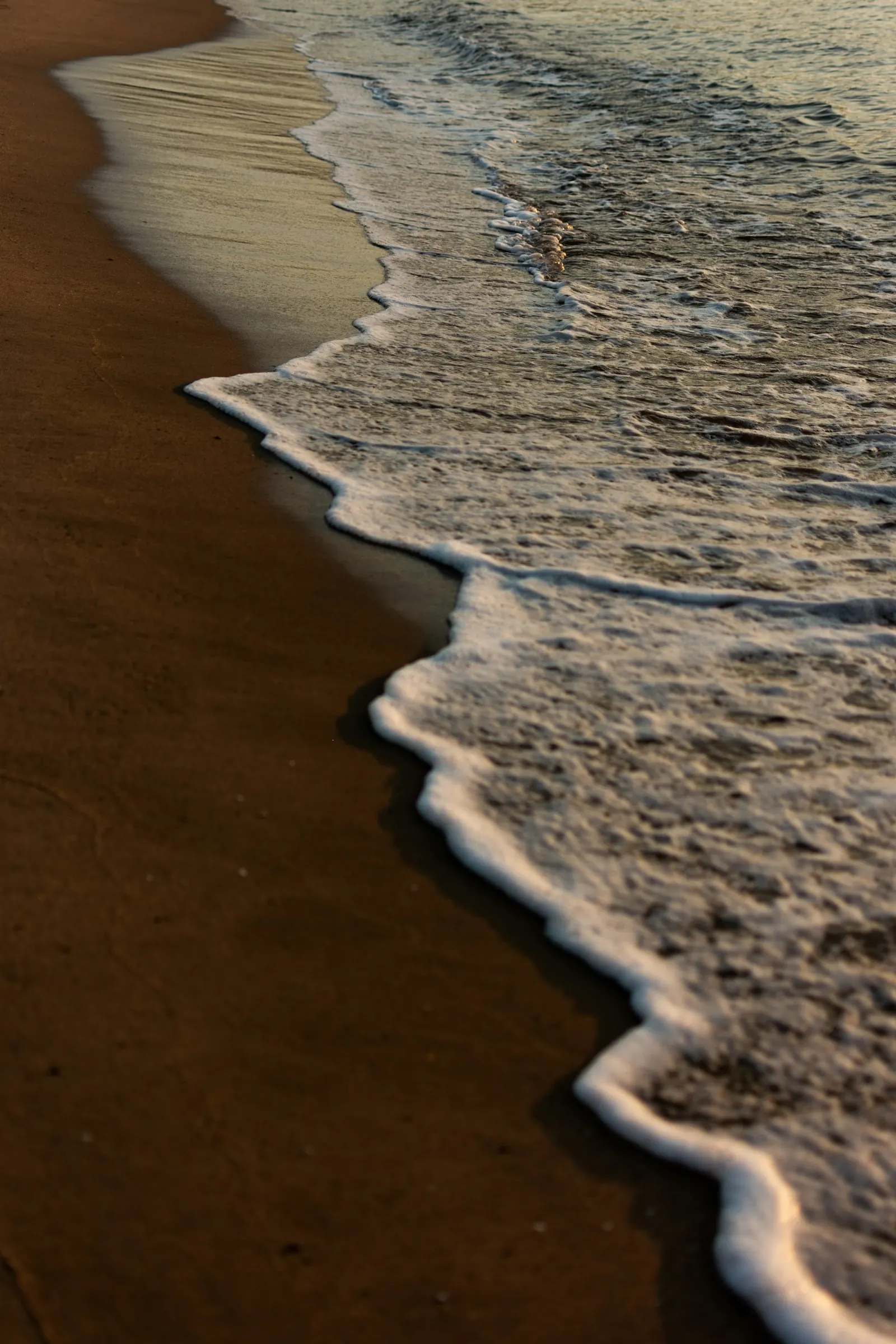 wave washing up on beach