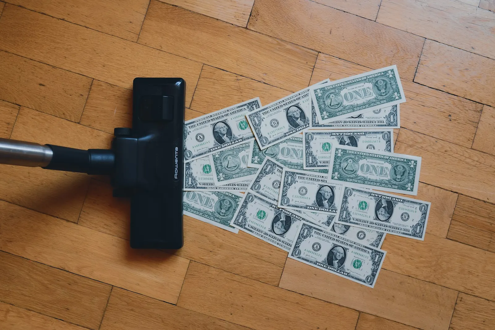 vacuum cleaner picking up money