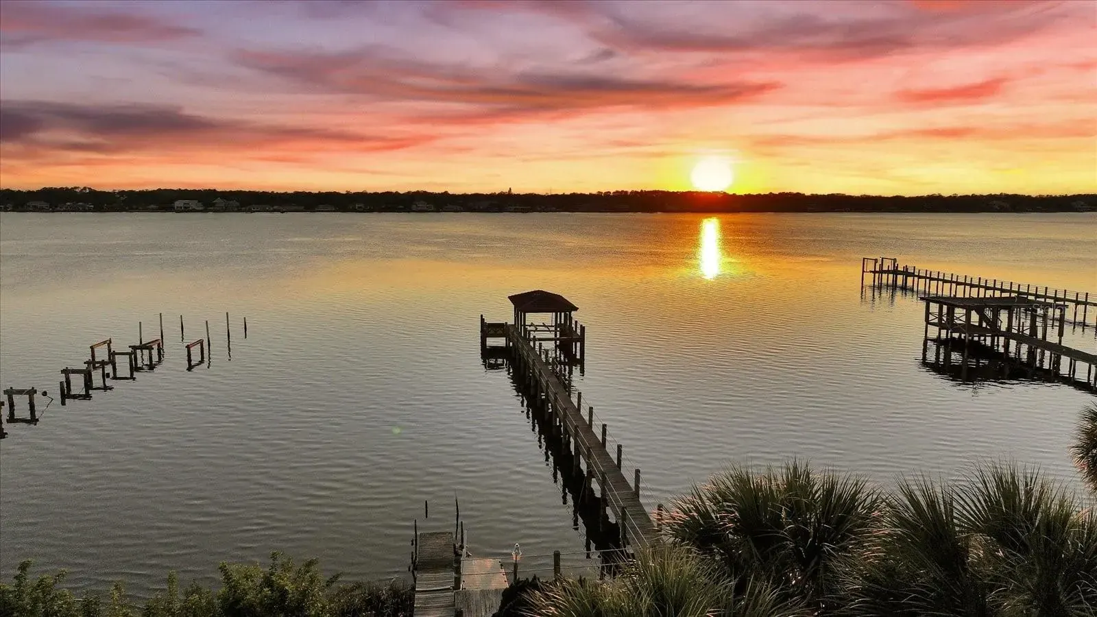 Sunset over the Halifax River and private docks in Ormond-by-the-Sea