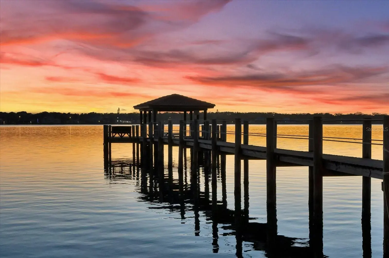 Covered dock on the Halifax River at sunset in Ormond-by-the-Sea