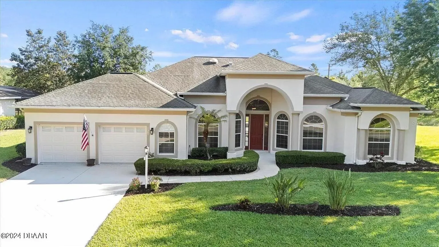 Ormond Beach home with a hip roof