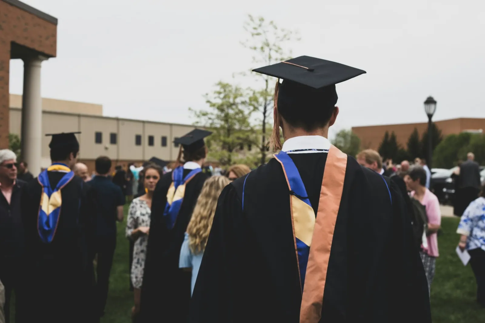 college student wearing cap and gown