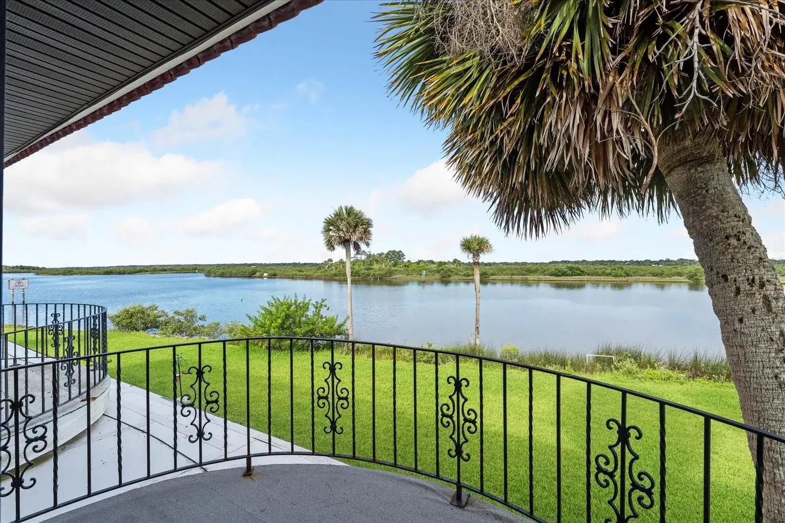 Intracoastal Waterway view with palm trees from a Flagler Beach home