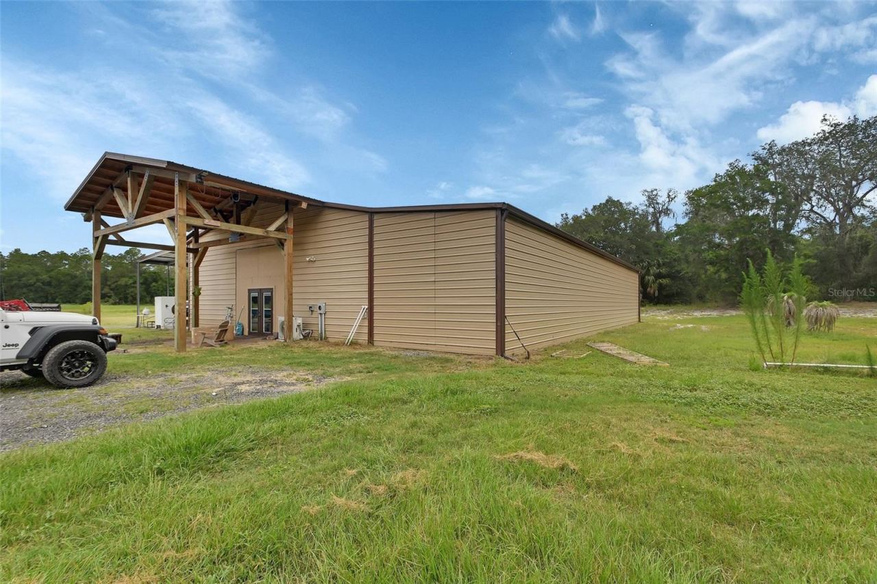 Photo 2 of 4940 State Road 11, De Leon Springs, FL 32130